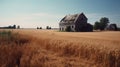 Rustic countryside farm with a weathered red barn with blue sky, rolling fields of golden wheat ready for harvest Royalty Free Stock Photo