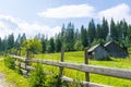 Rustic courtyard behind a wooden fence Royalty Free Stock Photo