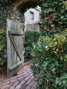 Rustic Courtyard With Wood Gate and Brick Path