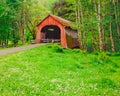 Rustic covered bridge guards a remote road in Yachats, Oregon