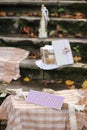 Rustic decor and fallen autumn leaves. Beautiful inscription wedding.