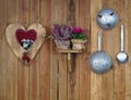 Rustic decorated wooden interior typical of the alpine hut with antique kitchen utensils, edelweiss and mountain flowers