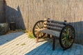 Rustic decorative bench with decorative wagon wheels. Country decor. Background Royalty Free Stock Photo