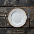 Rustic dining style Empty plate, fork, knife on gray wood Royalty Free Stock Photo