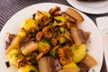 traditional rustic dish. fried potatoes with chanterelle mushrooms and pork brisket with herbs Royalty Free Stock Photo