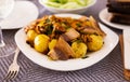 traditional rustic dish. fried potatoes with chanterelle mushrooms and pork brisket with herbs Royalty Free Stock Photo