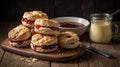 Delicious Homemade Scones with Strawberry Jam and Clotted Cream on Wooden Table Royalty Free Stock Photo