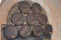 tacked Wooden Barrels in Brick Cellar with Firewood Royalty Free Stock Photo