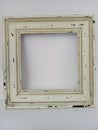 Rustic distressed wood picture frame on a white background