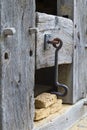 Rustic door latch on wooden door Royalty Free Stock Photo