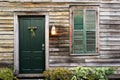 Rustic door and window with closed shutters