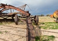 Rustic early road grader and gas container Royalty Free Stock Photo