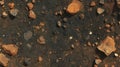 Rustic earthy surface with dark mud and rocks for textured background design Royalty Free Stock Photo