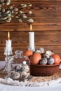 Rustic Easter, quail eggs in a ceramic bowl on the table. Royalty Free Stock Photo