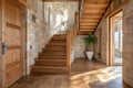 Rustic Elegance: Cozy Hallway with Wooden Staircase and Stone Cladding Wall, Modern Home Interior Entrance Royalty Free Stock Photo