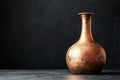 Rustic elegance of a single copper pot still on dark background Royalty Free Stock Photo