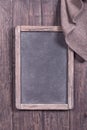 Rustic empty menu blackboard with napkin