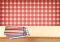 Rustic empty wooden table with tablecloth and retro background. Ready for product display montages