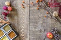 Rustic fall wooden background with spices, candles, berries, app