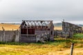 Rustic farm buildings in a field. Rockyview County, Alberta, Canada Royalty Free Stock Photo