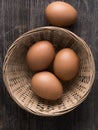 Rustic farm fresh chicken egg in basket Royalty Free Stock Photo