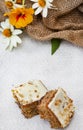 carrot cake squares on rustic table setup Royalty Free Stock Photo