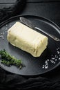 Rustic farmhouse inspired butter, on black wooden table background