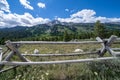 Rustic fence with the Grand Teton mountain range in the background in Wyoming USA during summer on a sunny day Royalty Free Stock Photo