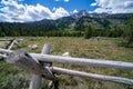 Rustic fence with the Grand Teton mountain range in the background in Wyoming USA during summer on a sunny day Royalty Free Stock Photo