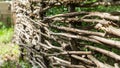 Rustic fence of interwoven twigs