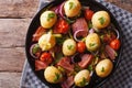 Rustic food: new potatoes with bacon on plate. Horizontal top vi Royalty Free Stock Photo