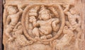 Rustic form of Hindu Lord on wall of temple, India. Pattadakal, UNESCO World Heritage site, 7th and 8th-century.