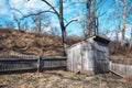 Rustic free range wooden chicken coop with fence on idyllic farm