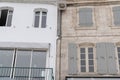 Rustic French building facade white wall and stone facades