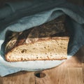 Rustic French rye bread loaf covered with kitchen towel Royalty Free Stock Photo