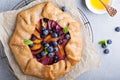 Rustic gallette pie with peaches and blueberry Royalty Free Stock Photo