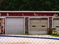 Rustic garage building with big roll-up doors