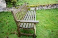 Rustic Garden Bench on Bright Green Grass Royalty Free Stock Photo