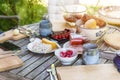 Rustic garden table prepared for an outside meal with the family