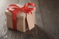 Rustic gift box with red ribbon bow and emmpty tag