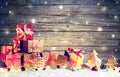 Rustic Gift Boxes On Snow With Christmas Ornament