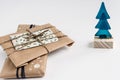 Rustic gifts in craft paper and christmas tree, simple handmade
