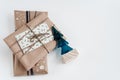 Rustic gifts in craft paper and christmas tree, simple handmade