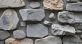 Rustic gray stone wall with irregularly shaped rocks and mortar for a timeless earthy texture Royalty Free Stock Photo