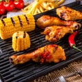 Rustic Grilled chicken wings,legs,and spicy corn