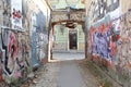 Rustic street art alleyway in Uzupio, a district in Vilnius, Lithuania Royalty Free Stock Photo