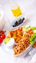 A Rustic gyros plate it green salad and potato wedges Royalty Free Stock Photo
