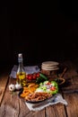 Rustic gyros plate it green salad and potato wedges Royalty Free Stock Photo
