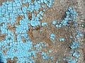 Rustic hardboard texture with scratches, cracks and blue peeling paint. Grunge background Royalty Free Stock Photo