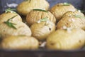 Rustic Hasselback potatoes with herbs, garlic and salt, vegetarian good quality food Royalty Free Stock Photo